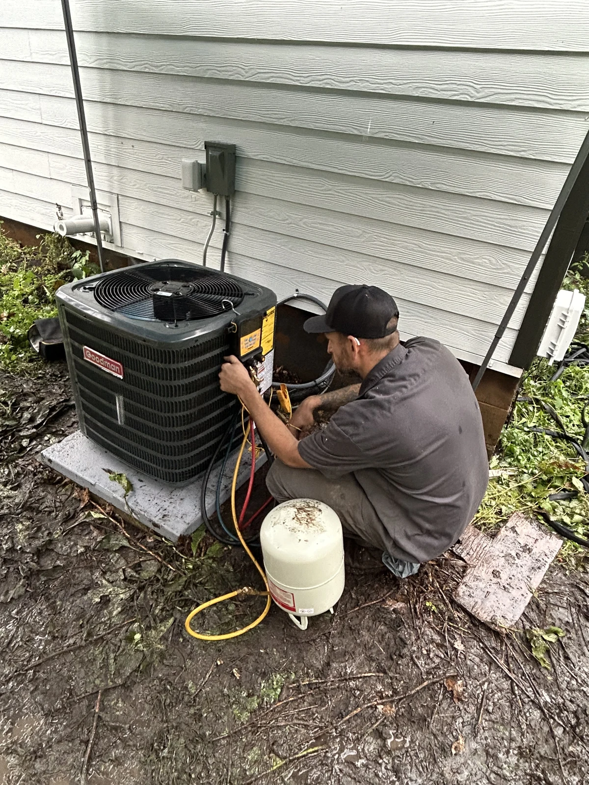 Randy of Furnace Direct installing an outdoor AC unit at a Minnesota home